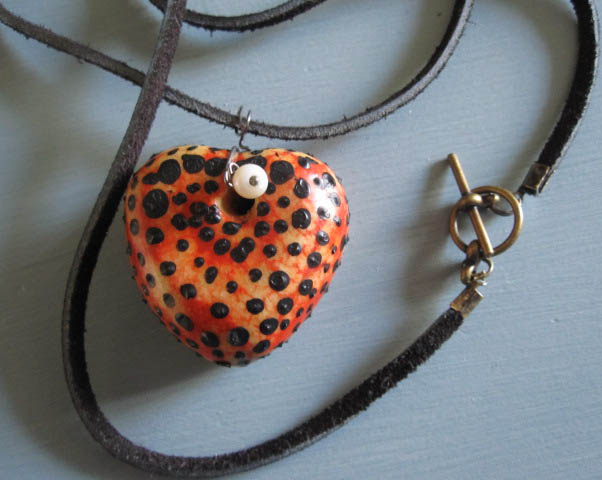 heart, thong and dull brass clasp